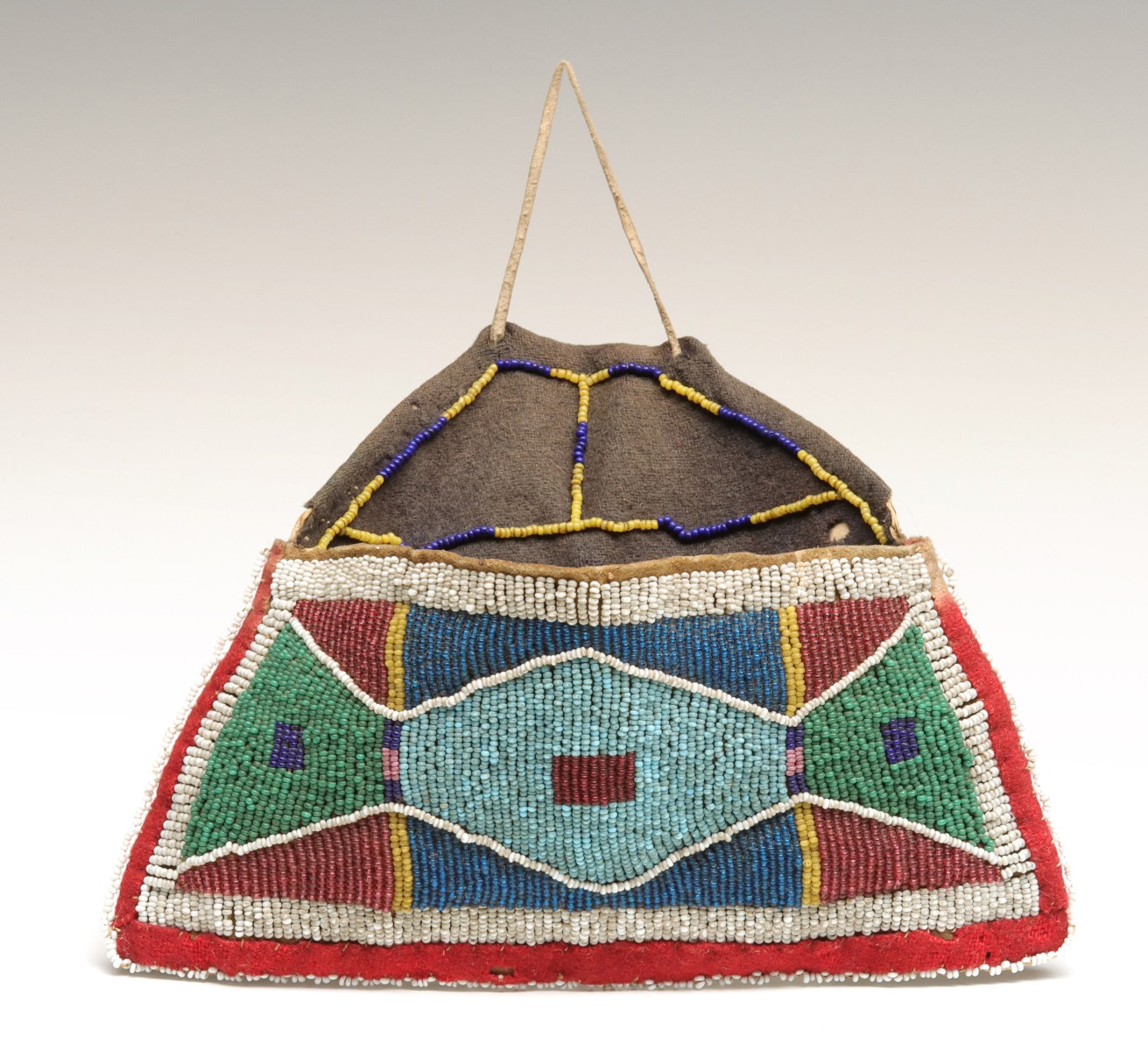 A CROW SINEW SEWN BEADED HIDE POUCH CIRCA 1890