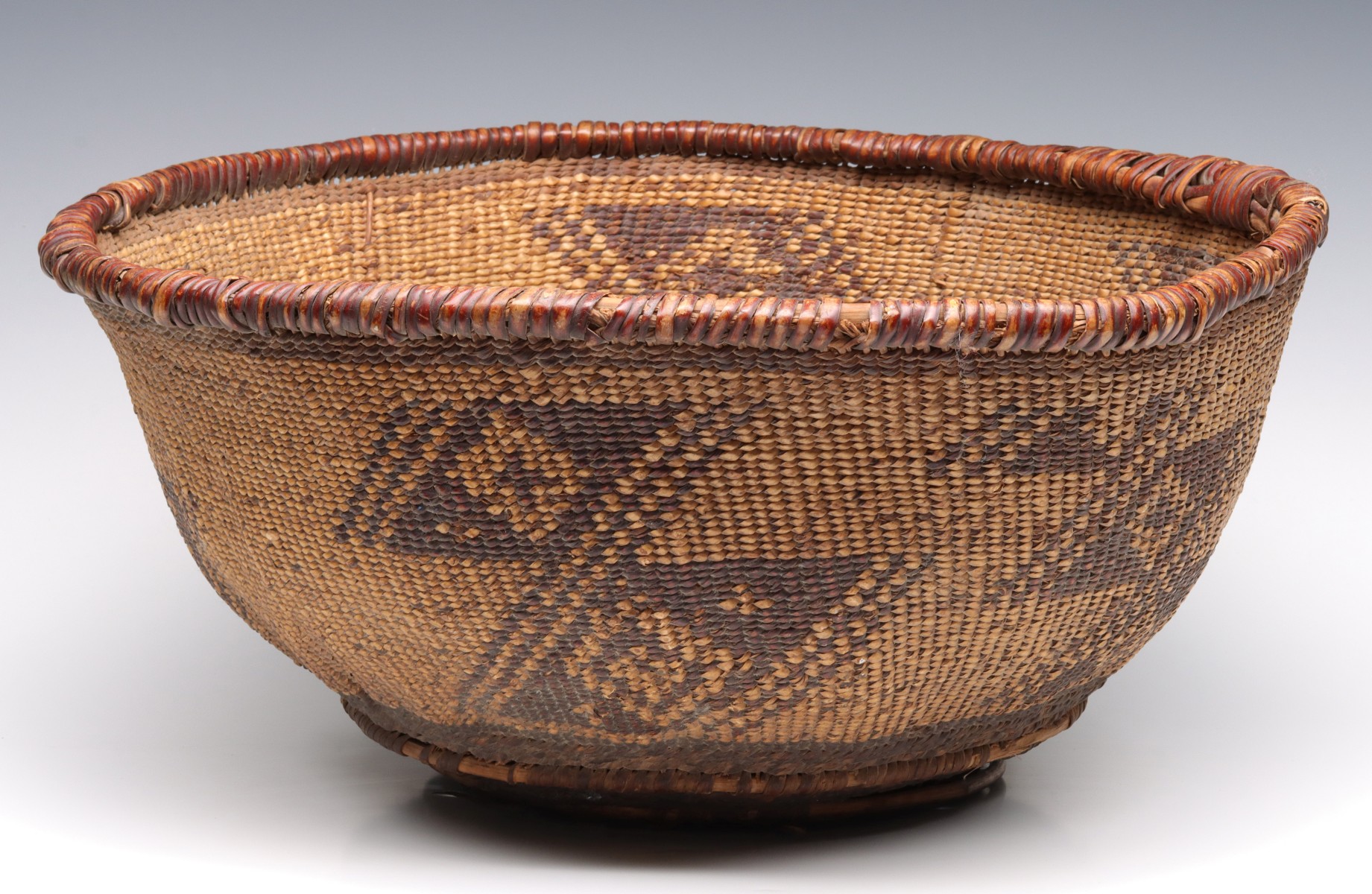 A LARGE YORUK BASKETRY BOWL 18 INCHES DIAMETER