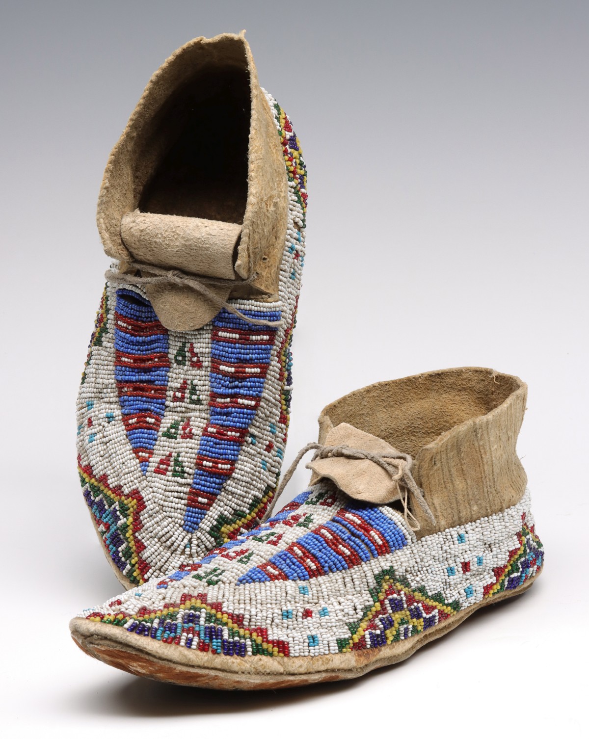 A GOOD PAIR OF SIOUX BEADED MOCCASINS CIRCA 1910