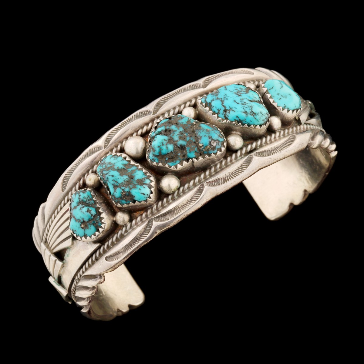 A SILVER AND TURQUOISE BRACELET SIGNED K. MONTOYA