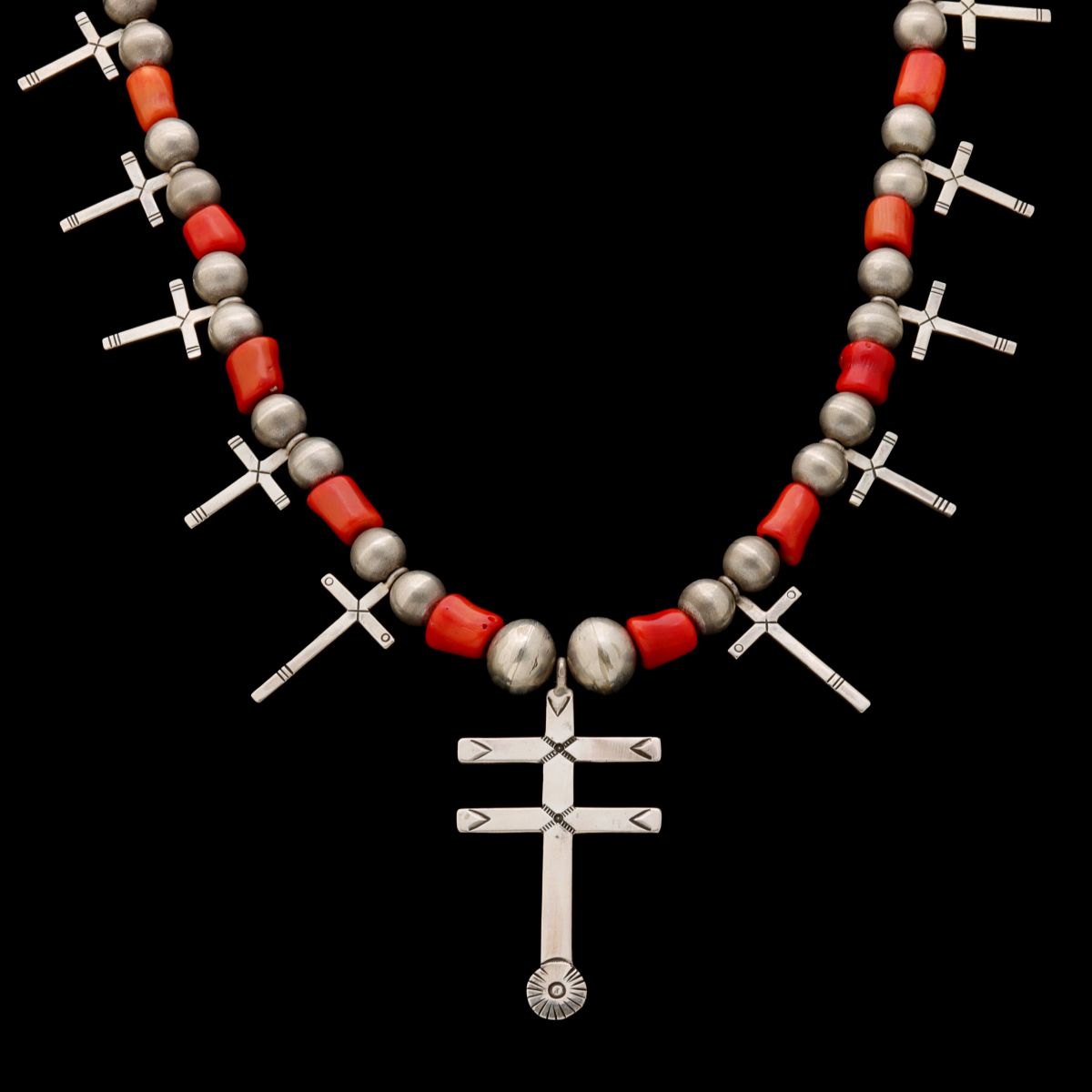 A HOPI STERLING AND CORAL NECKLACE WITH ELEVEN CROSSES