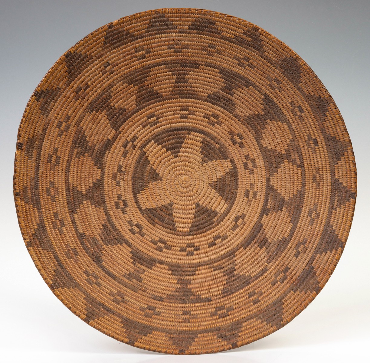 A LATE 19TH CENTURY APACHE BASKETRY TRAY
