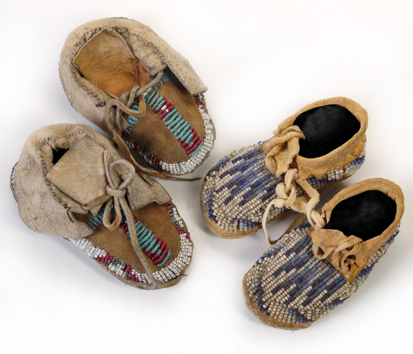 EARLY 20TH C. NORTHERN PLAINS CHILD'S MOCCASIN PAIRS