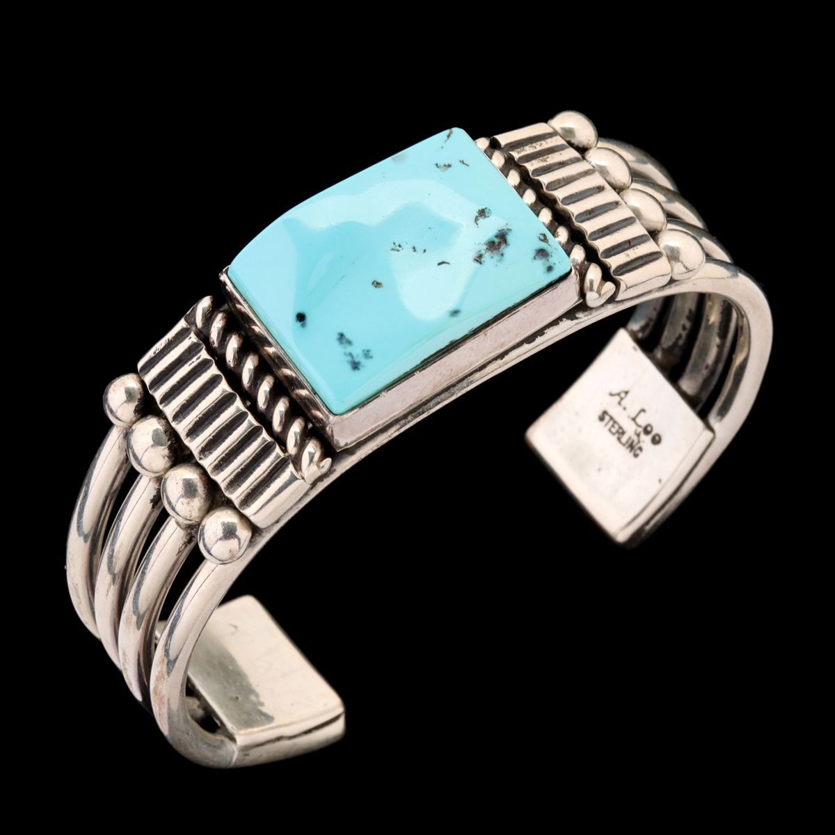 A STERLING CUFF WITH TURQUOISE SIGNED ALLISON LEE