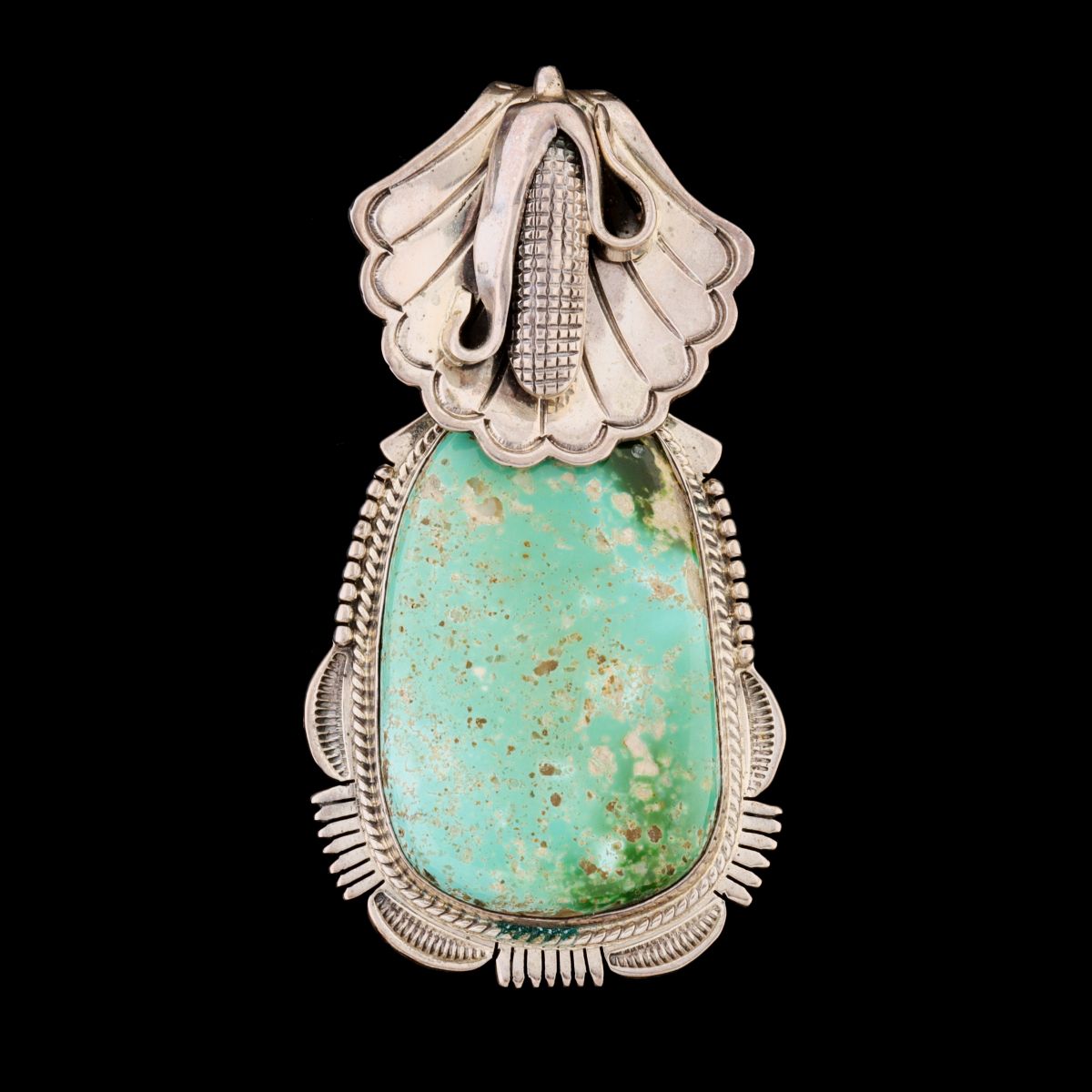 A ROYSTON TURQUOISE PENDANT SIGNED BENNIE RATION