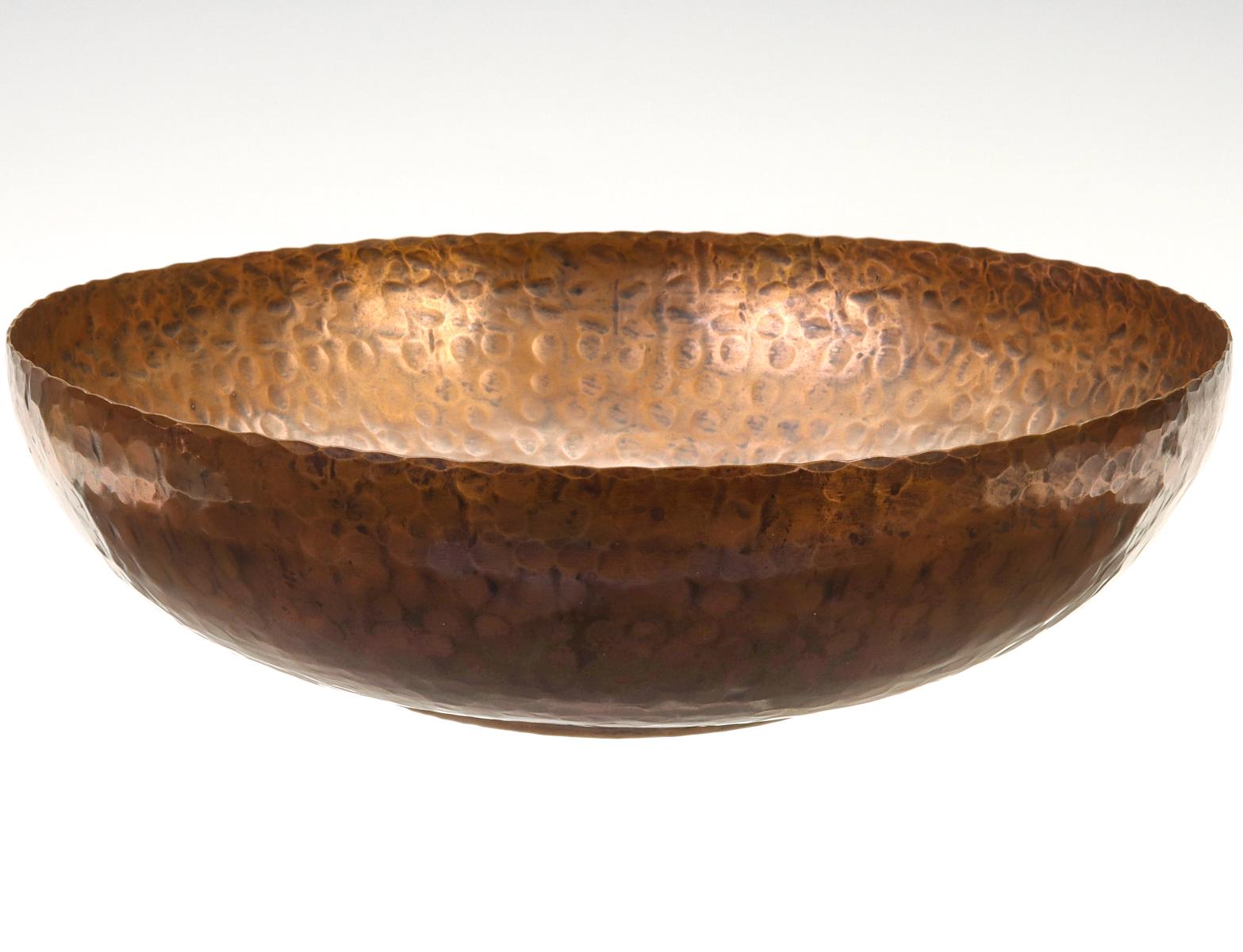 A LARGE HAMMERED COPPER BASIN SIGNED HARRY DIXON
