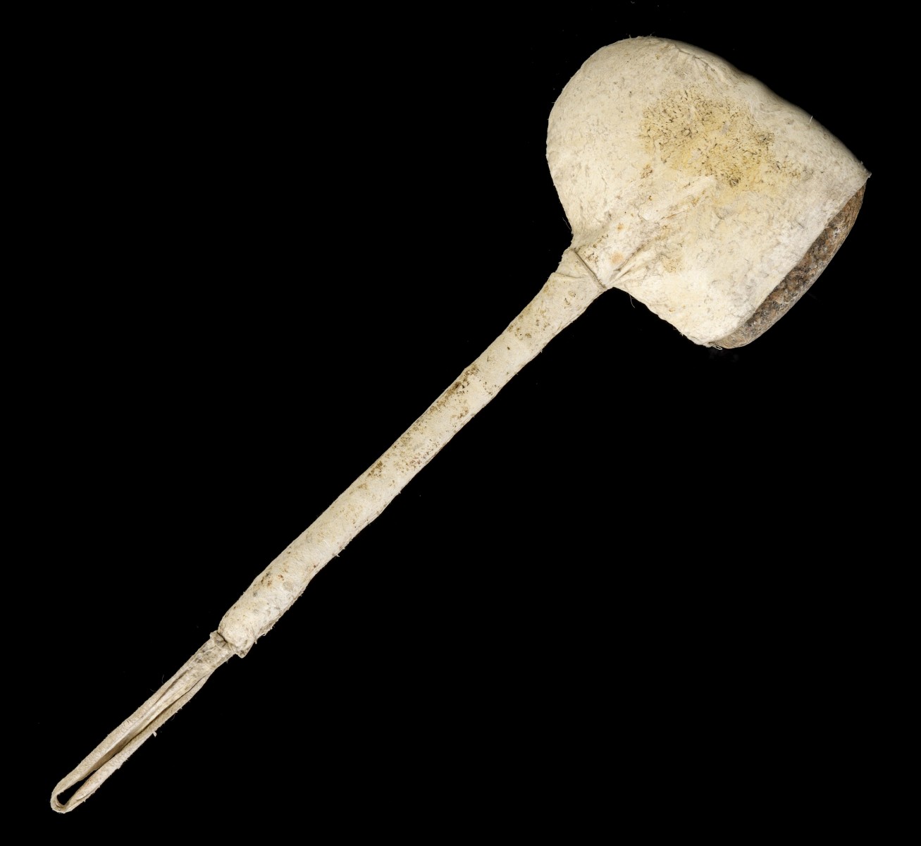 AN EARLY 20TH CENTURY HIDE WRAPPED STONE CLUB