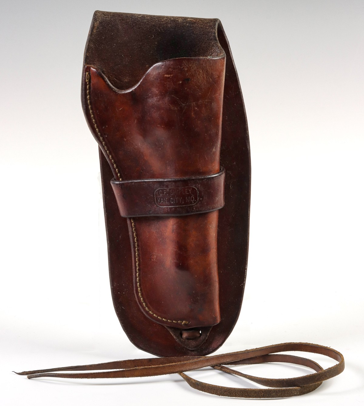 A LEATHER FOLD-OVER HOLSTER BRANDED C.P. SHIPLEY