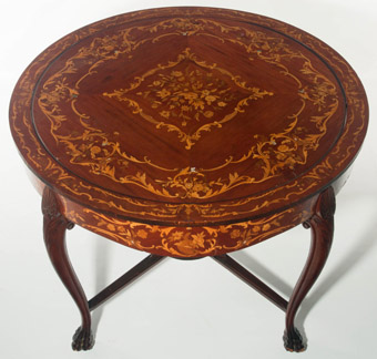 A Late 19th Century Marquetry Center Table with Hidden Games Top
