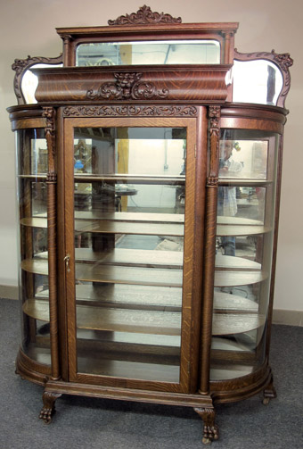 A Mirrored Oak Griffin China Cabinet