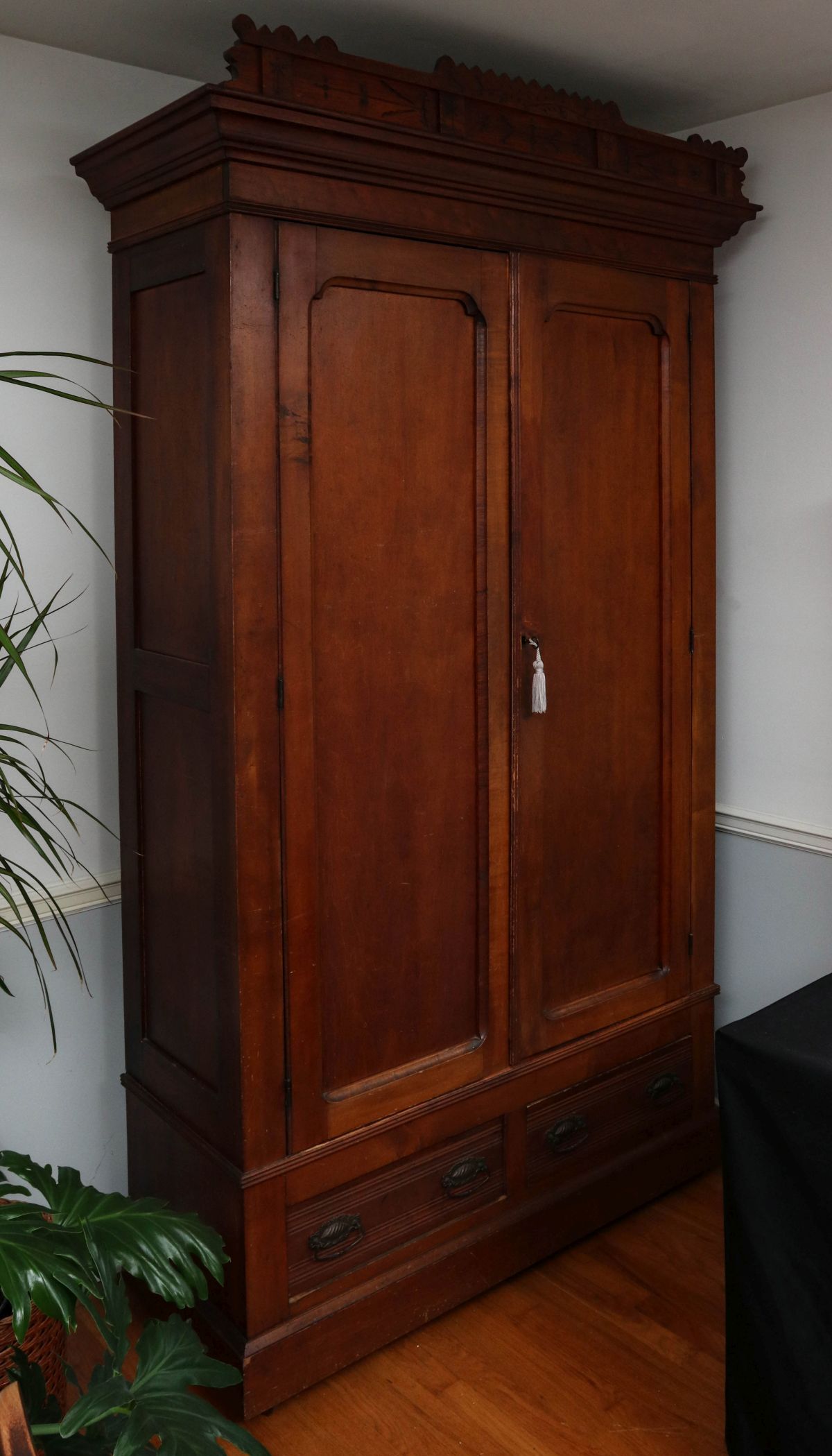 A STATELY VICTORIAN EASTLAKE STYLE TWO DOOR ARMOIRE