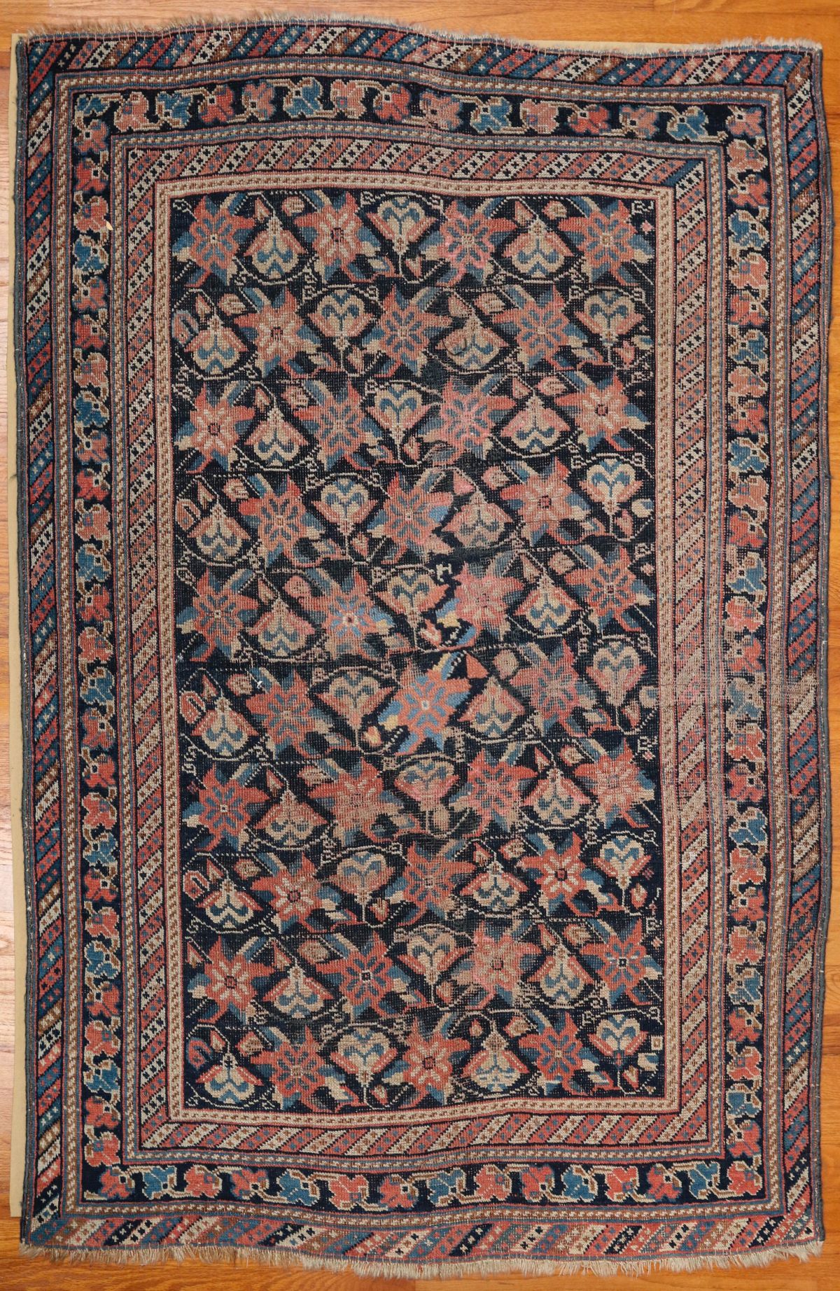 A HAND MADE SEMI ANTIQUE CAUCASIAN SCATTER RUG