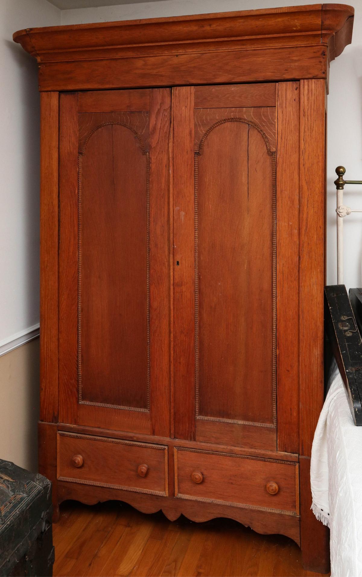 A TALL 19TH C. TWO DOOR WARDROBE WITH DRAWERS