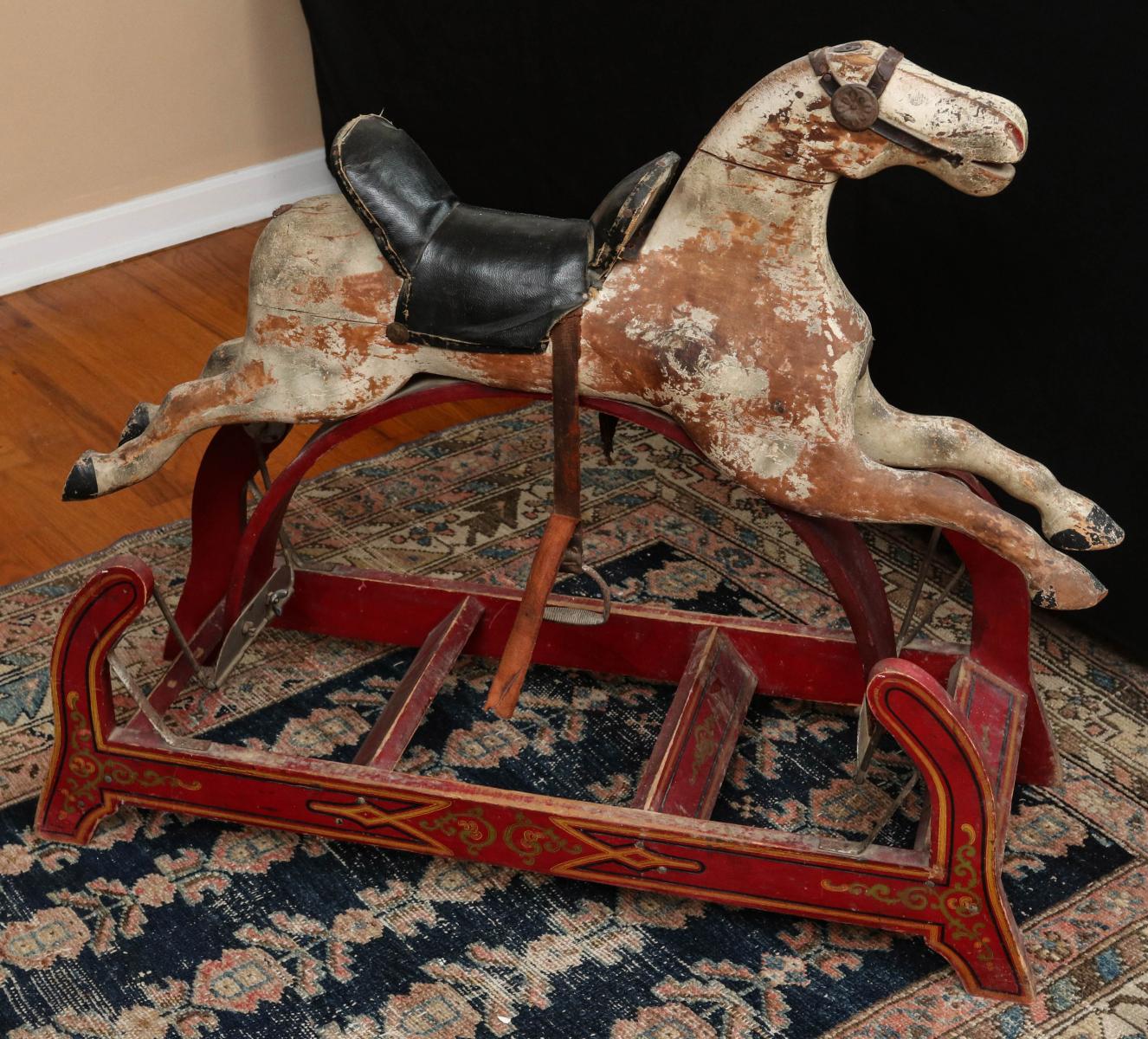 A FOLKY 19TH C. AMERICAN SWING HORSE IN OLD PAINT