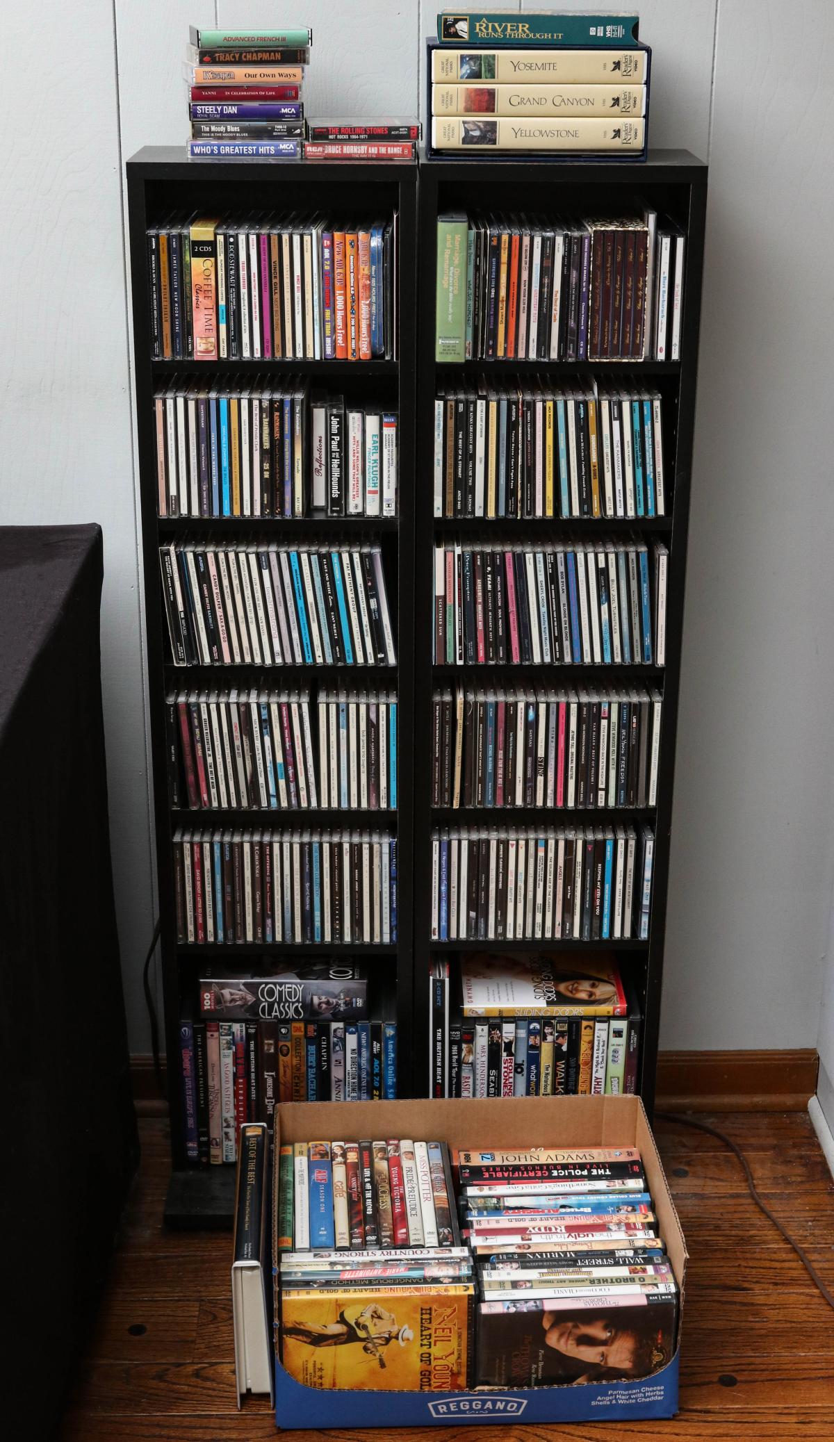 A LARGE COLLECTION OF CDs, DVDs WITH SHELVES