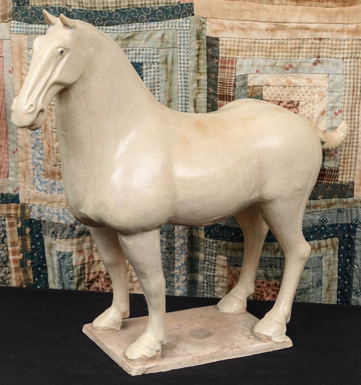 A 20TH CENTURY CERAMIC TANG STYLE HORSE