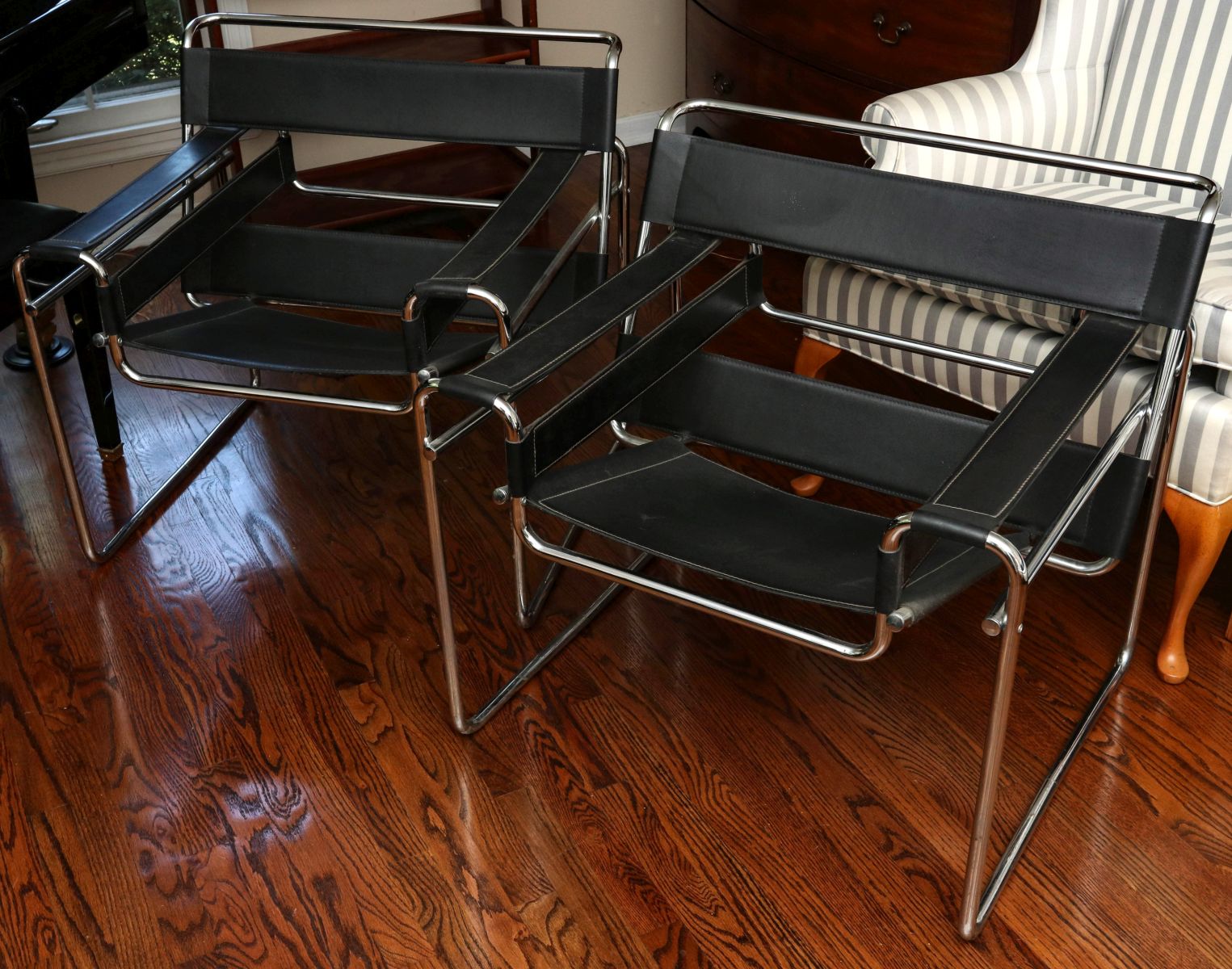 A PAIR OF SLING CHAIRS AFTER THE BREUER WASSILY CHAIR