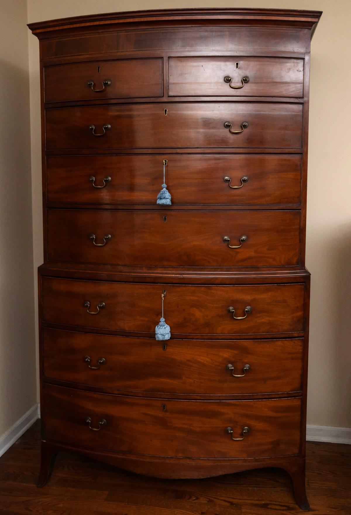 A FINE GEORGIAN MAHOGANY BOW FRONT CHEST ON CHEST