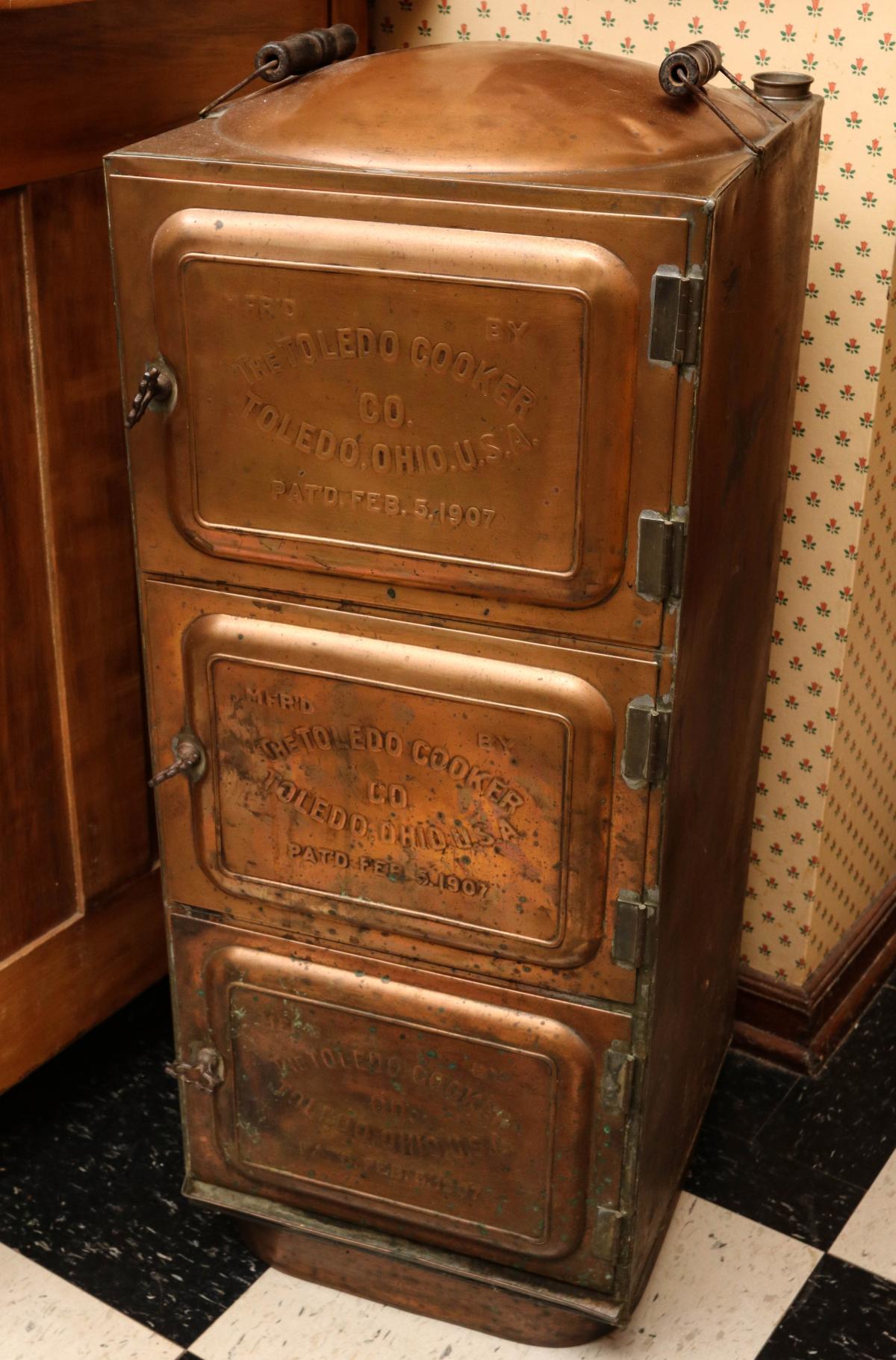A COPPER COOKER DATED 1907