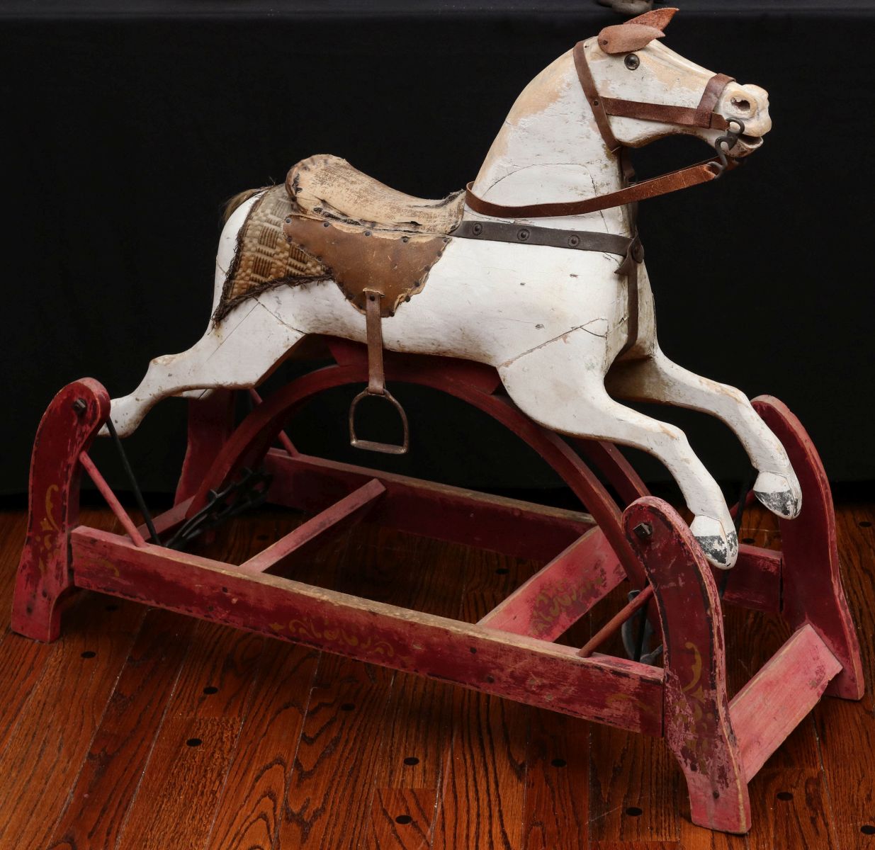 A 19TH CENT. CARVED AND PAINTED WOOD SWING HORSE