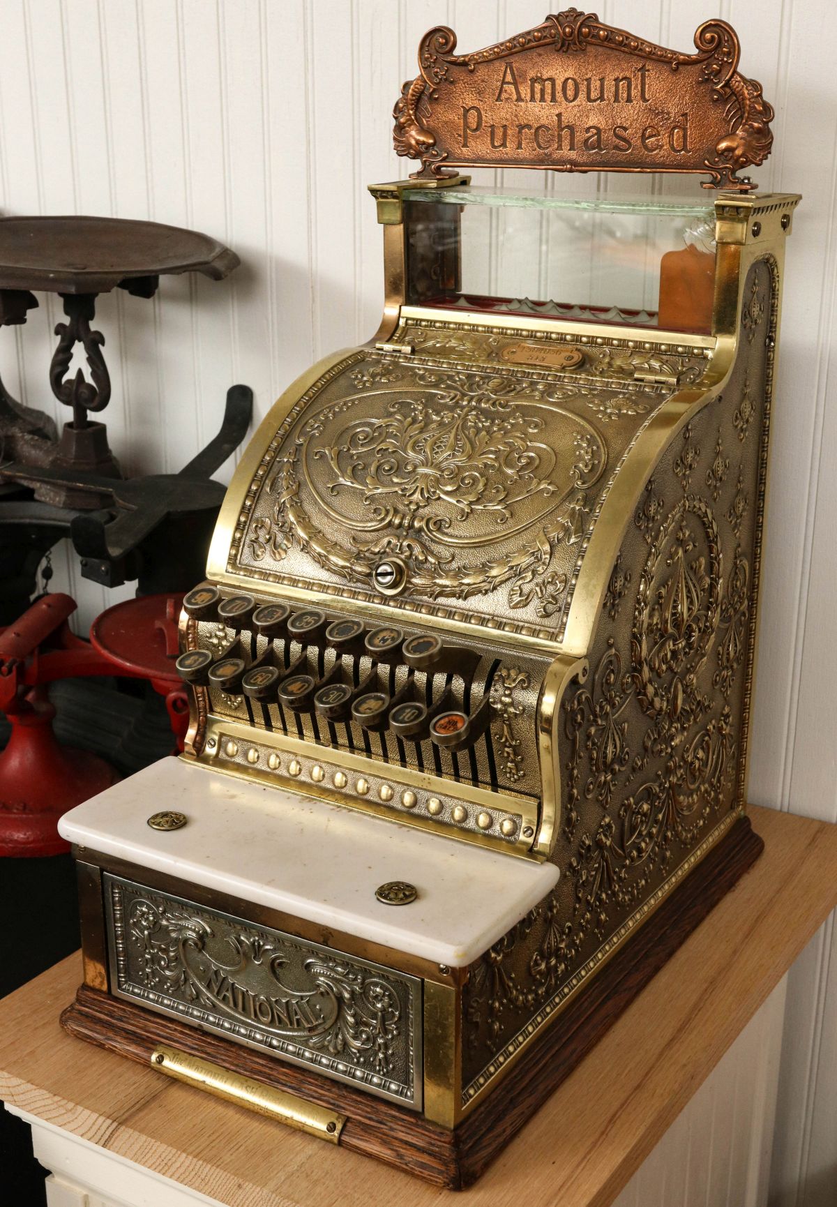 A NATIONAL CASH REGISTER MODEL 313 WITH TOP SIGN
