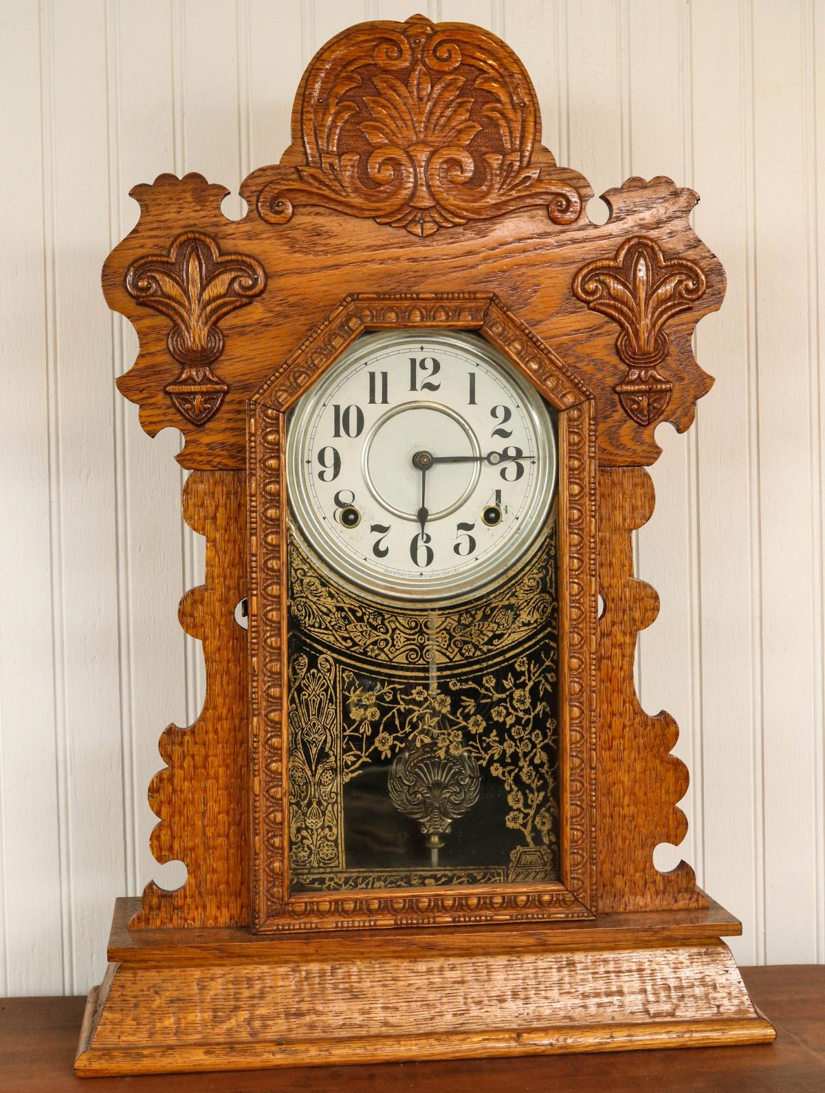 A CIRCA 1900 INGRAHAM OAK GINGERBREAD KITCHEN CLOCK