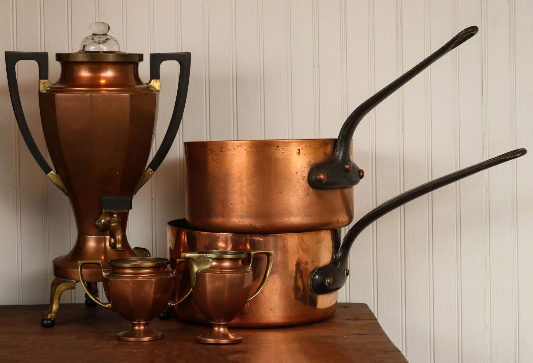 TWO FRENCH COPPER SAUCE PANS WITH IRON HANDLES