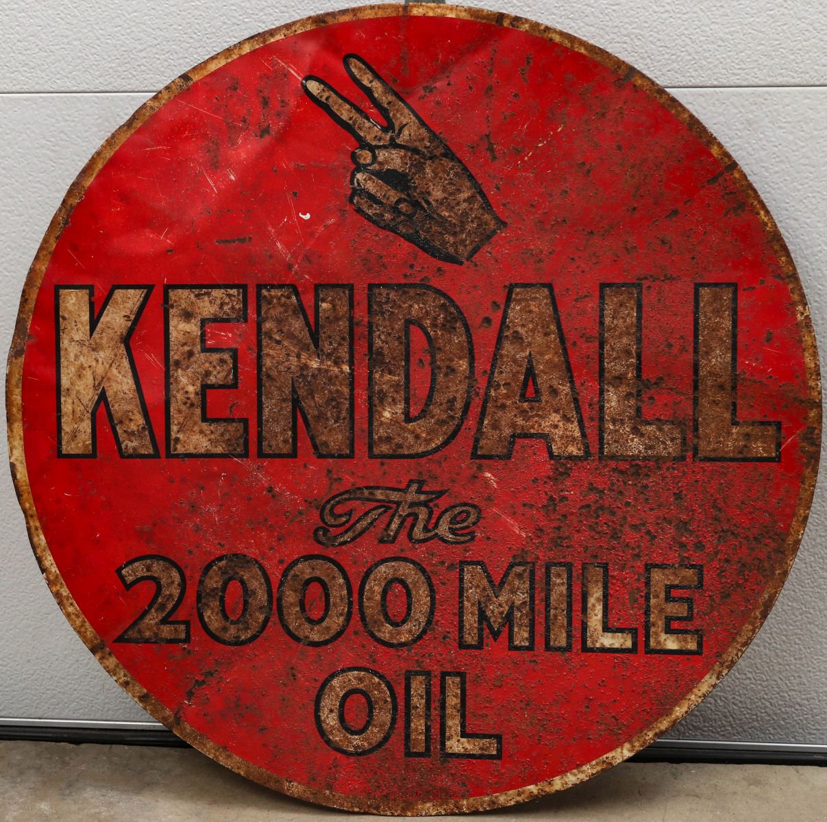 A TWO SIDED KENDALL MOTOR OIL SIGN AS FOUND