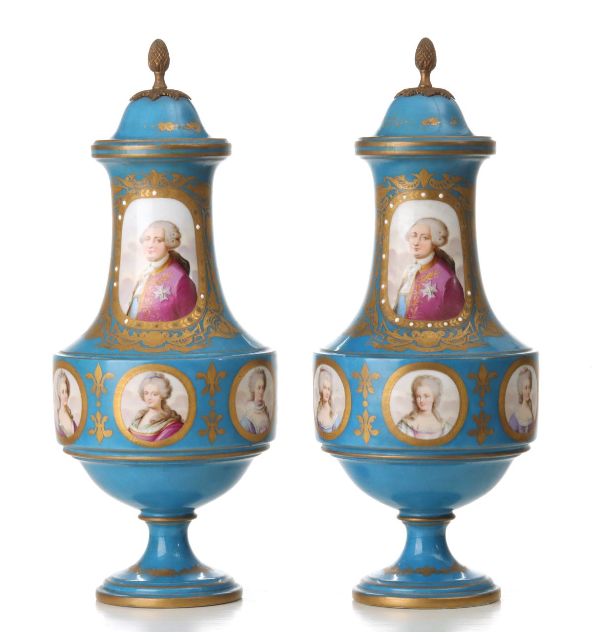 A PAIR HAND PAINTED FRENCH PORCELAIN COVERED URNS
