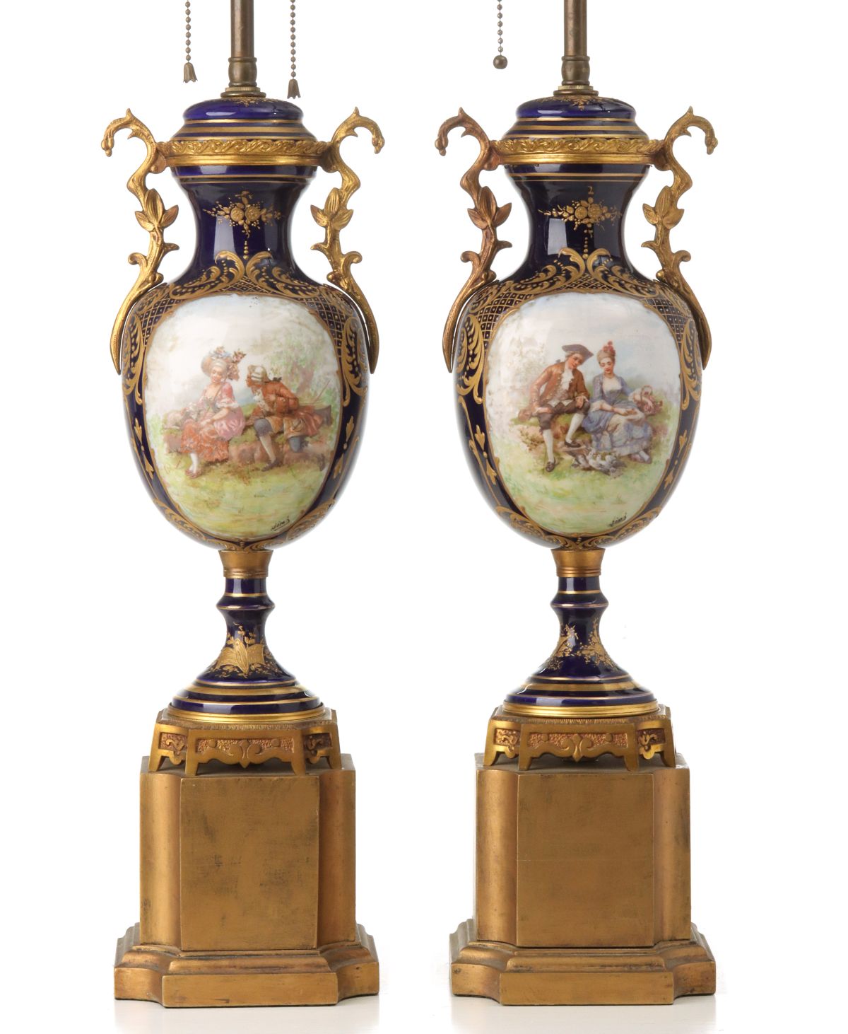 A PAIR 19TH C. FRENCH GILT BRONZE AND PORCELAIN LAMPS
