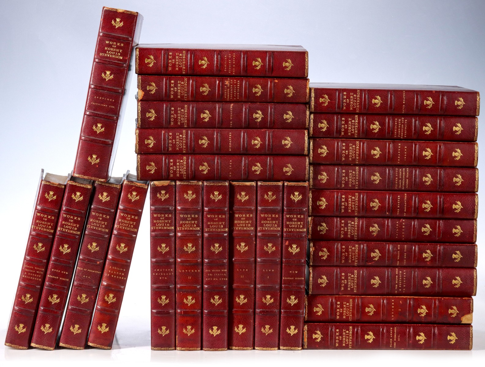 WORKS OF ROBERT LOUIS STEVENSON BOUND IN RED LEATHER