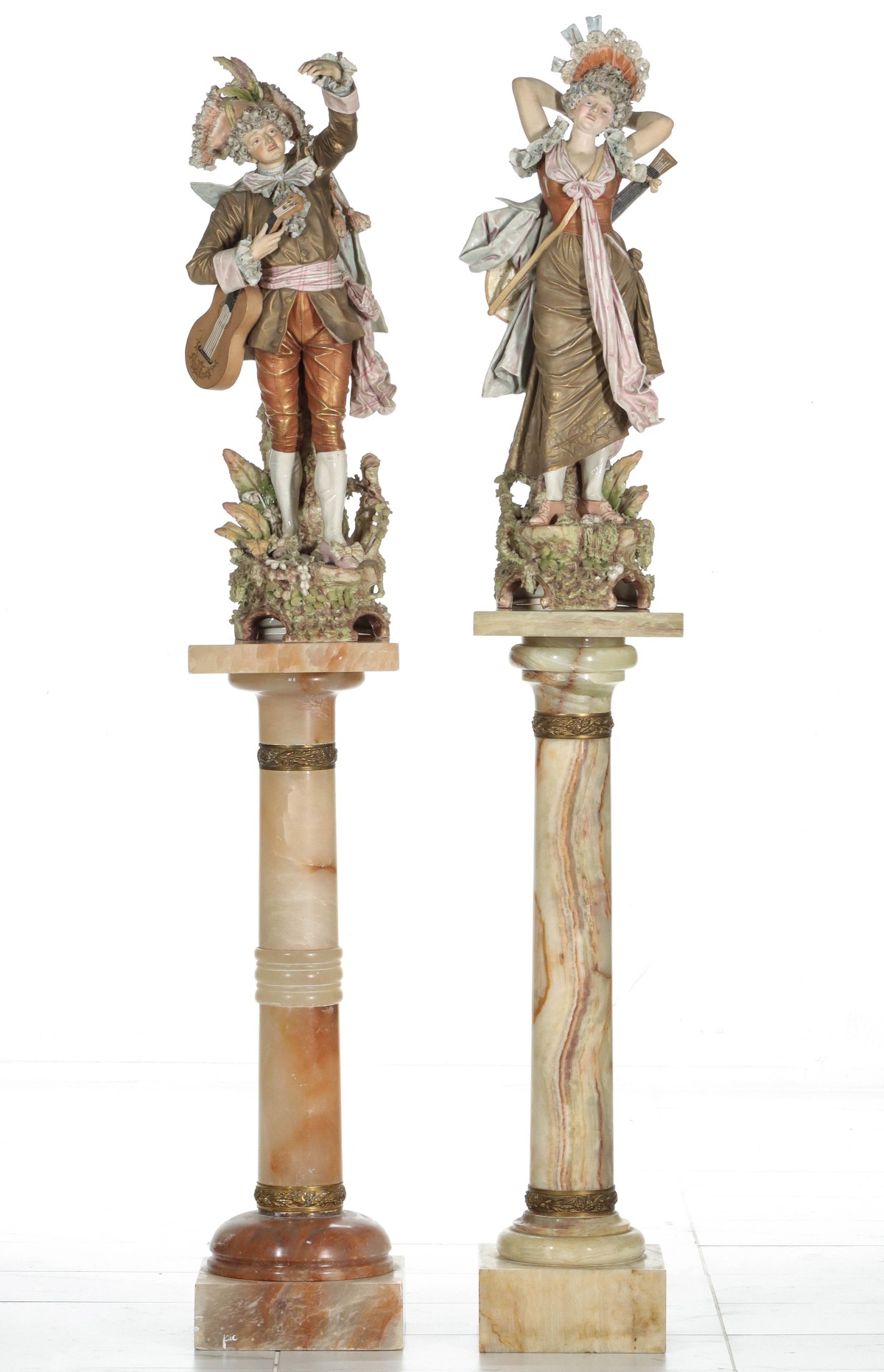 ROYAL DUX FIGURES ON ONYX AND ALABASTER PEDESTALS