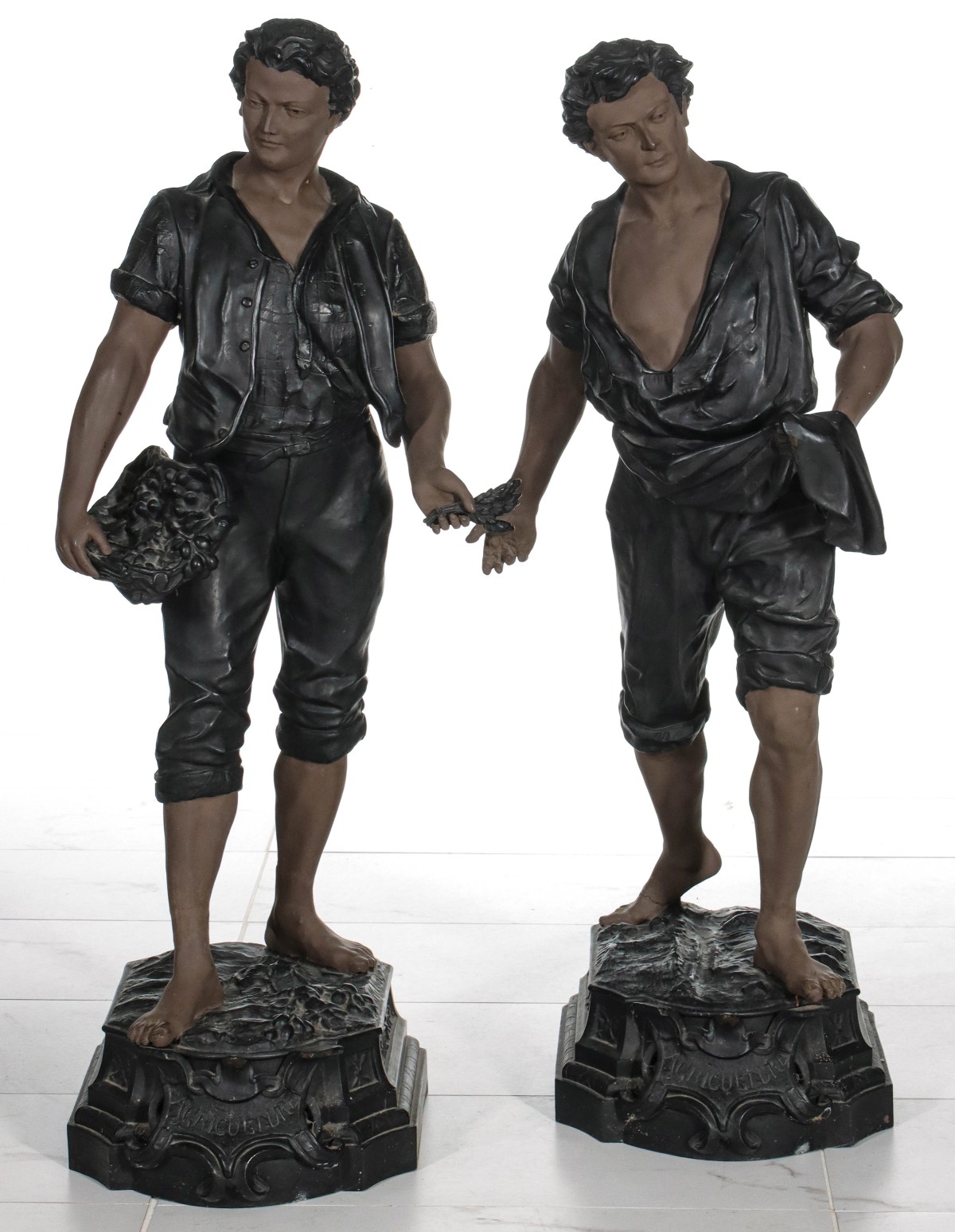 A PAIR 44-INCH SPELTER FIGURES SIGNED F. MILLIOT