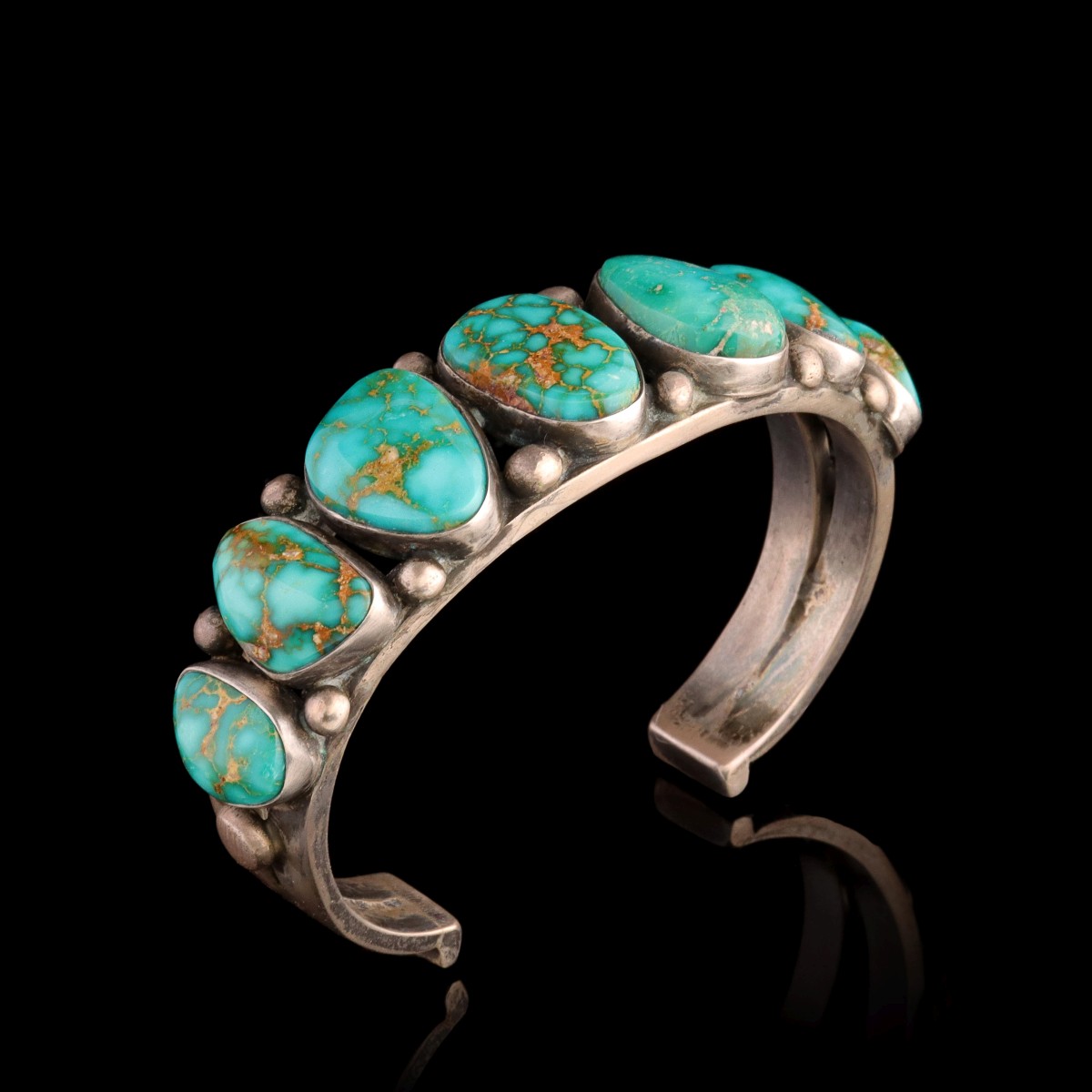 A STERLING SILVER AND TURQUOISE MEN'S CUFF BRACELET