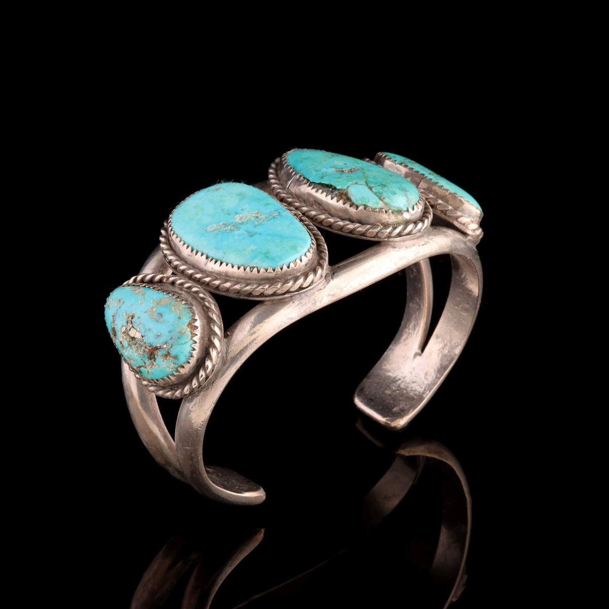 A MAN'S STERLING SILVER CUFF WITH LARGE TURQUOISE