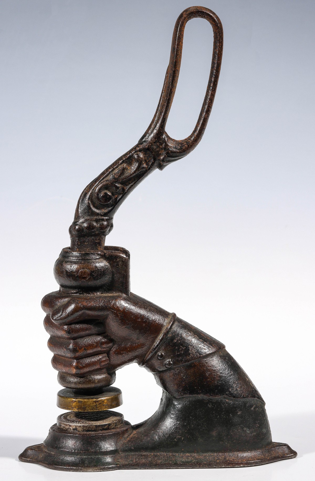 A LARGE FIGURAL CLENCHED FIST IRON SEAL C. 1890