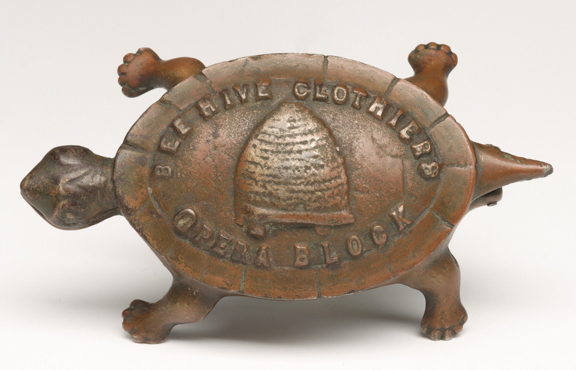 IRON TURTLE 'BEEHIVE CLOTHIERS' MATCH SAFE C. 1900