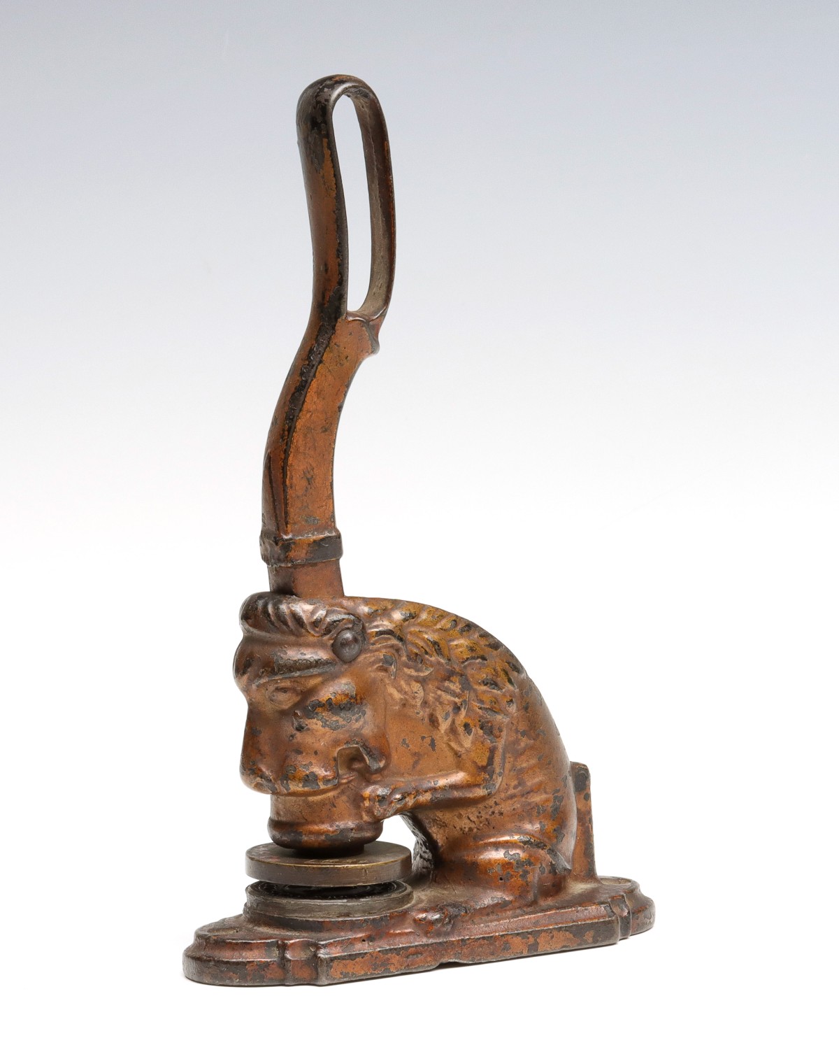 A LARGE FIGURAL SEATED LION IRON SEAL C. 1890
