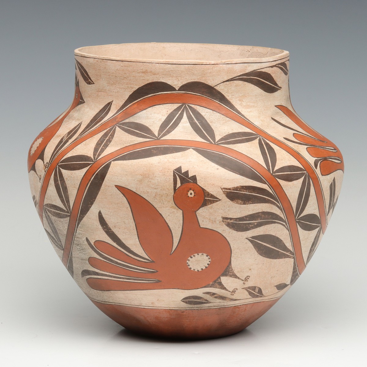 AN ACOMA PUEBLO POTTERY OLLA WITH PARROTS