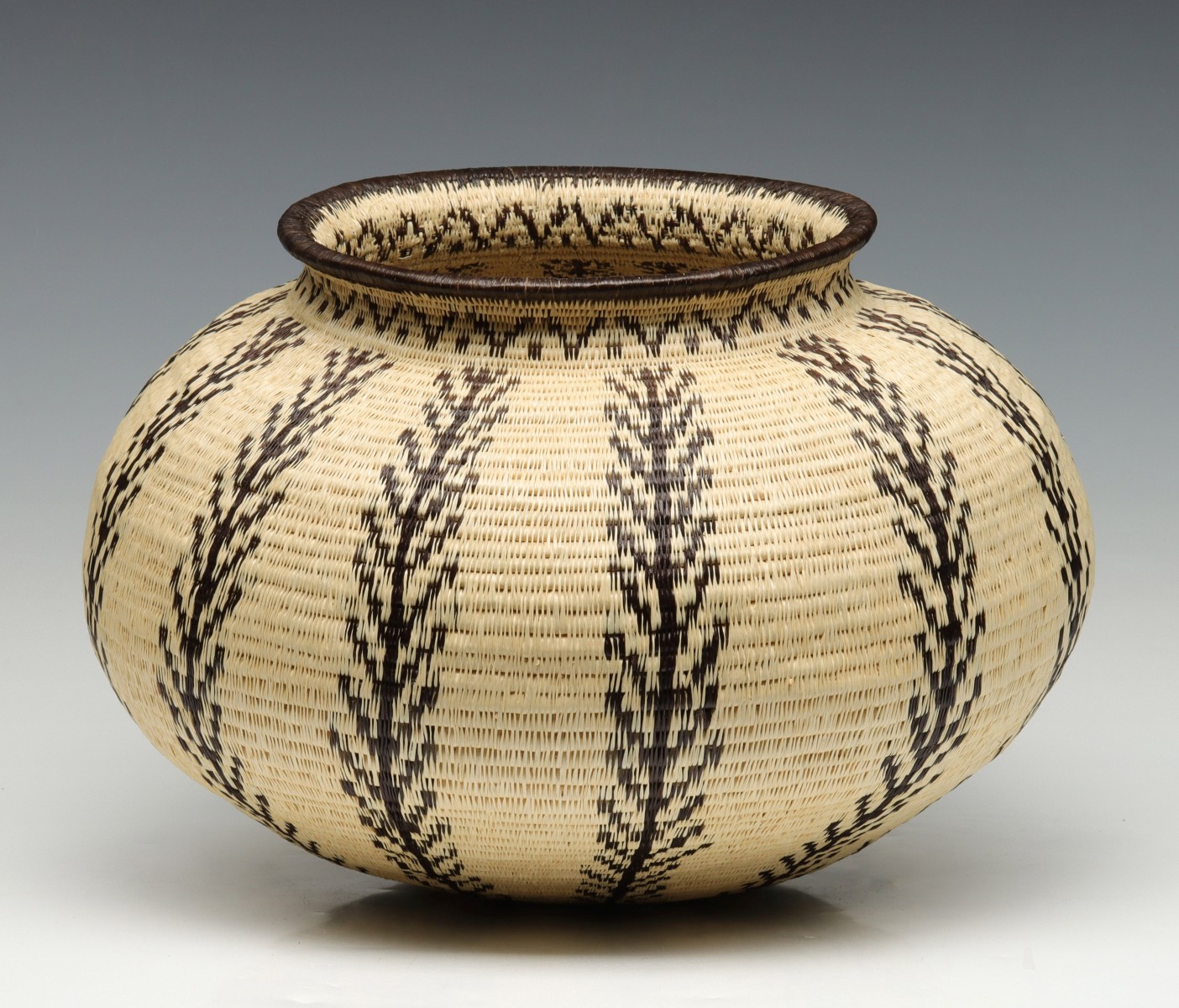 A LARGE LATE 20TH CENTURY WOUNAAN BASKET