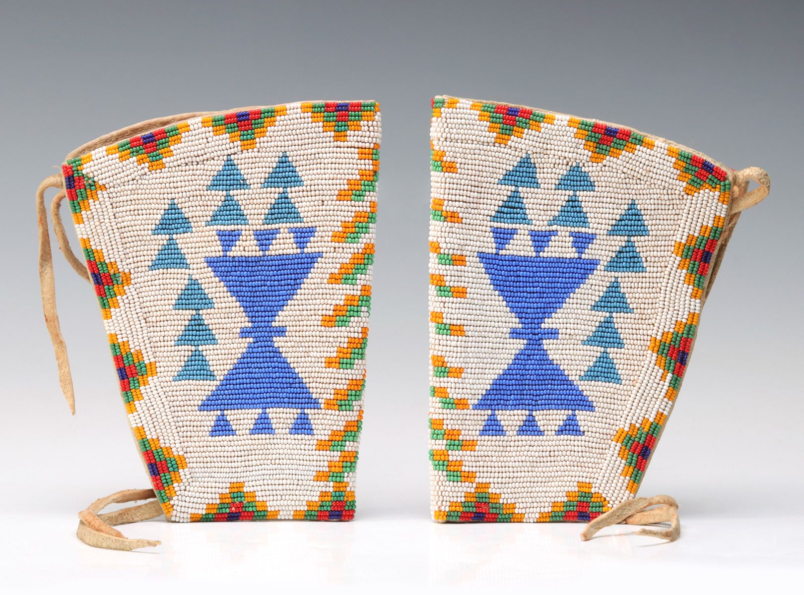 A PAIR OF PLAINS BEADED GAUNTLETS CIRCA 1930