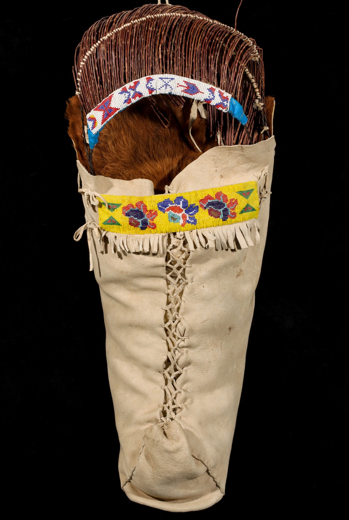 A TANNED HIDE AND BEADWORK UTE CRADLEBOARD