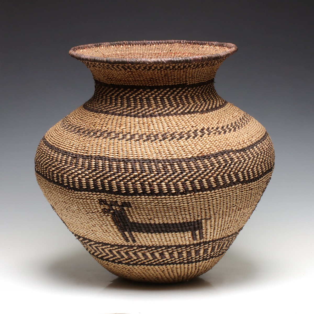 A LARGE BASKETRY OLLA ATTRIBUTED AS CONTEMPORARY APACHE