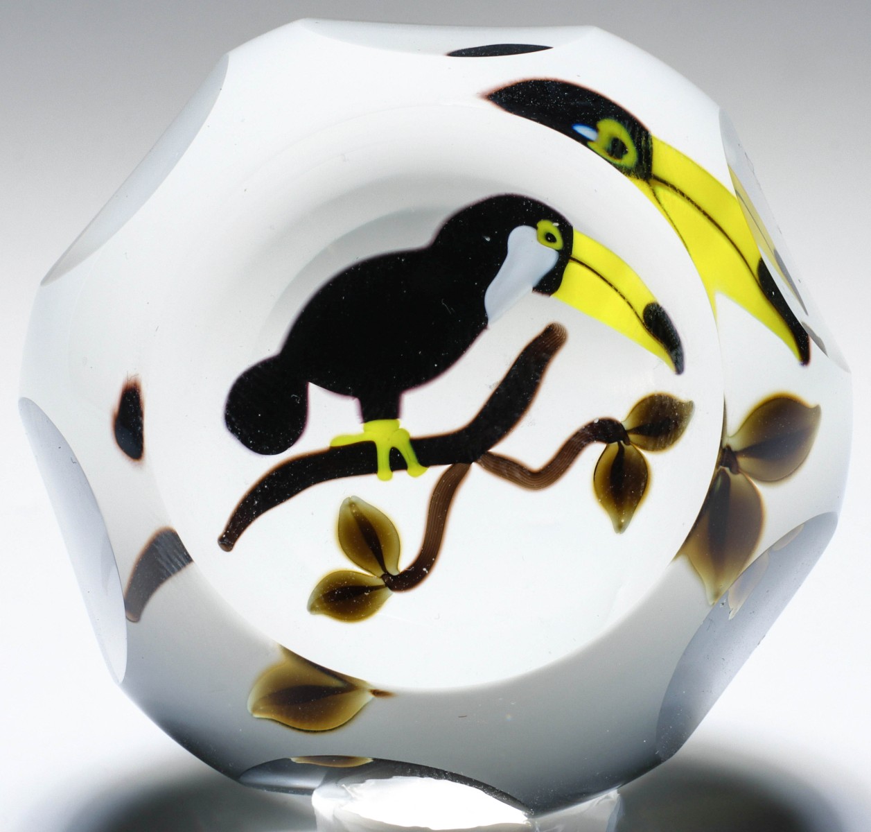 A PERTHSHIRE SIX FACETED PAPERWEIGHT WITH TOUCAN
