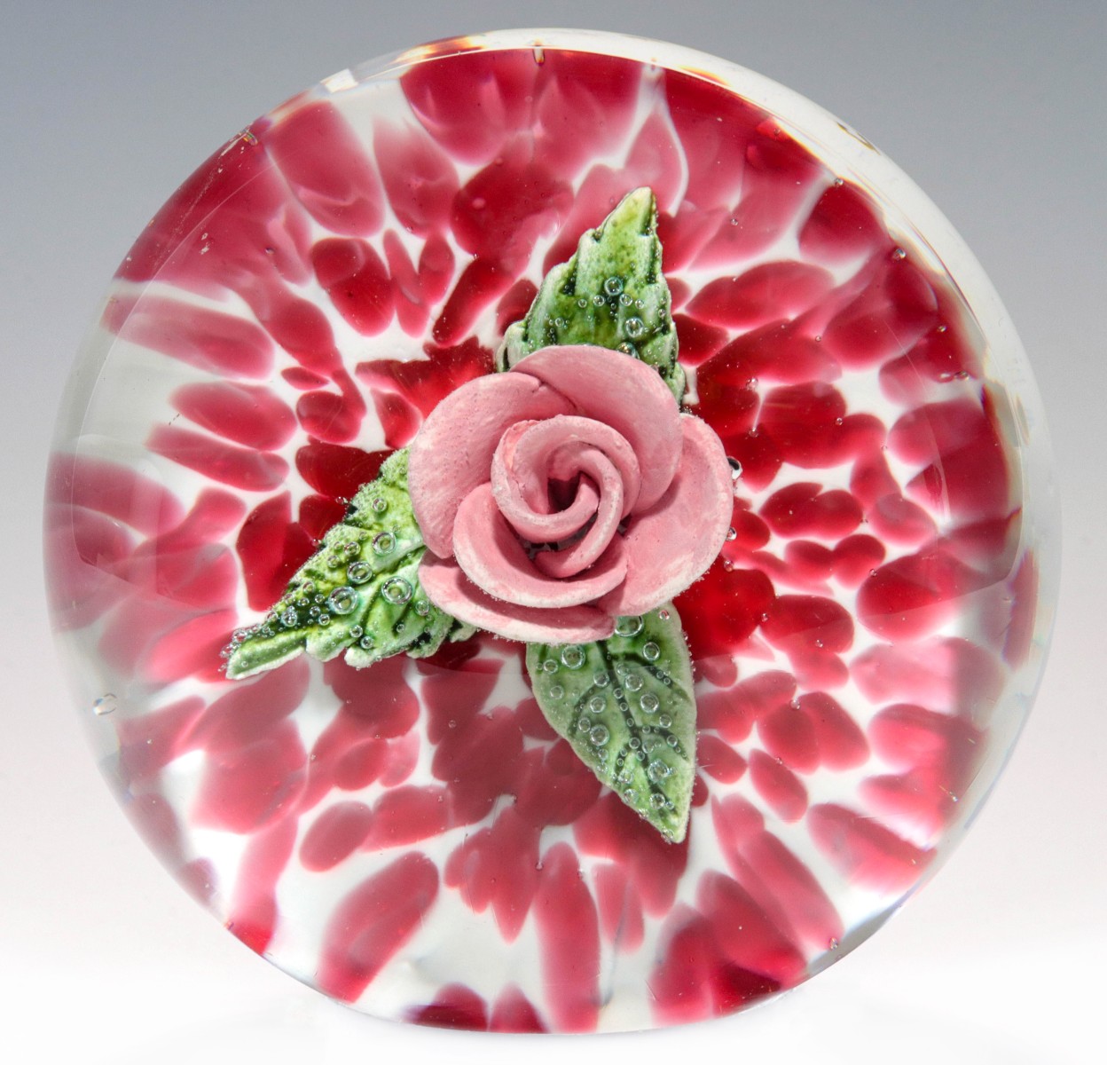 A RARE ST. CLAIR PAPERWEIGHT WITH PINK CERAMIC ROSE