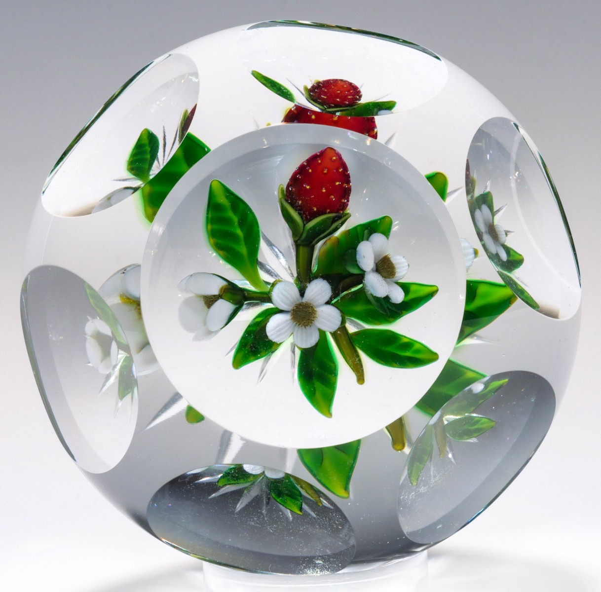 A DELMO TARSITANO FACETED PAPERWEIGHT WITH STRAWBERRIES