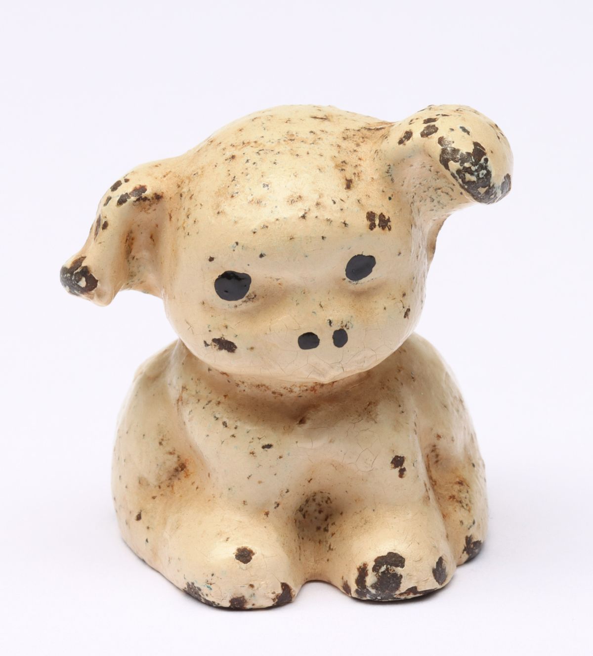 A FIGURAL PUP CAST IRON ADVERTISING PAPERWEIGHT