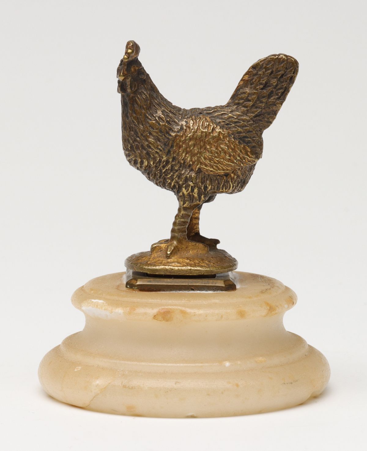 A BRASS FIGURAL ROOSTER WAX SEAL IN ALABASTER