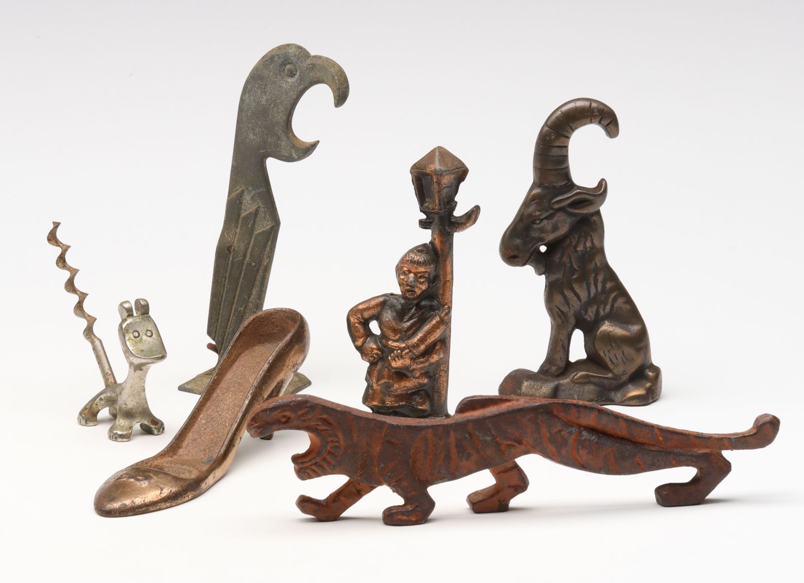 A COLLECTION OF VINTAGE FIGURAL BOTTLE OPENERS