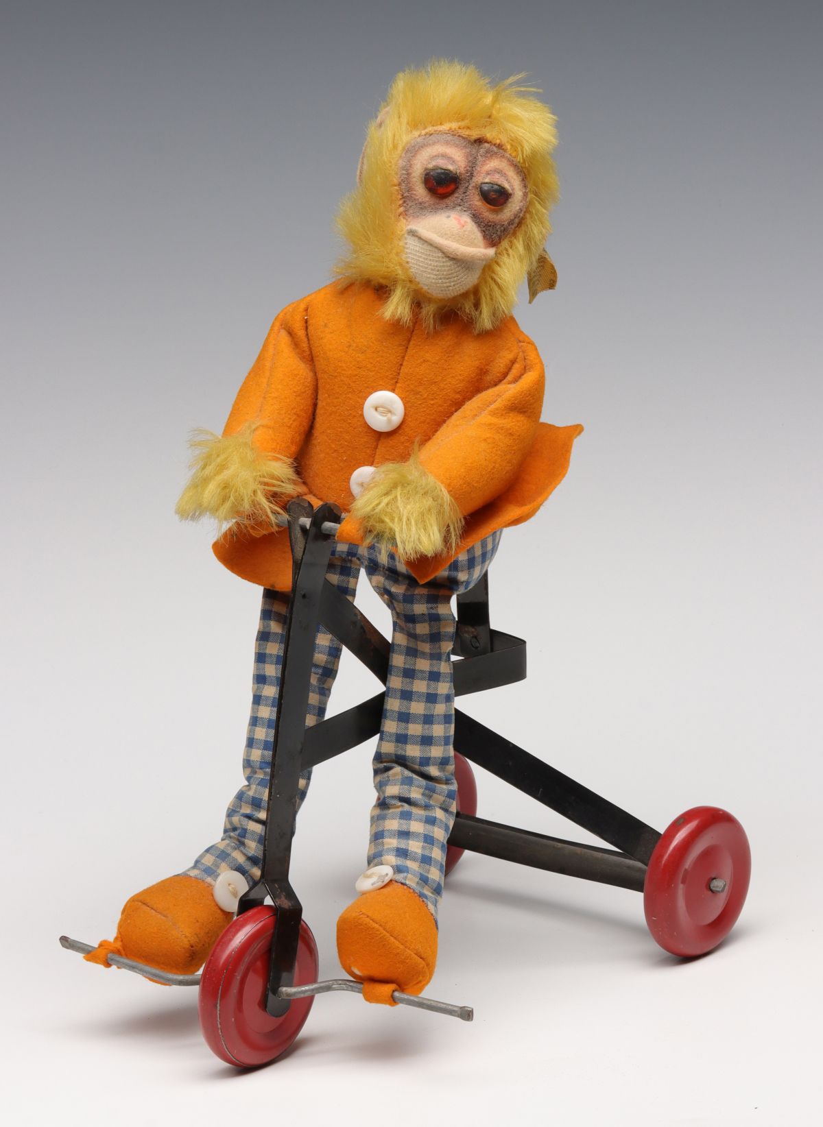 A CHARACTER NOVELTY TOY CO MONKEY ON TRICYCLE